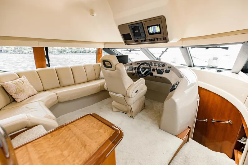Sonshine Yacht Photos Pics Luxurious interior of 2004 Carver 56 Voyager yacht with plush seating and modern helm.