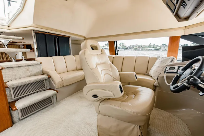 Sonshine Yacht Photos Pics Luxurious interior of 2004 Carver 56 Voyager yacht with plush seating and modern helm.