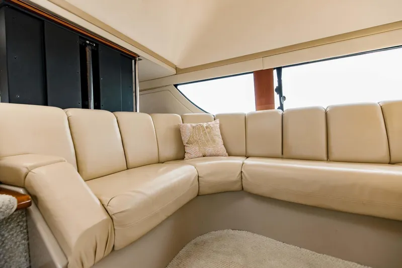 Sonshine Yacht Photos Pics Luxurious beige leather seating in 2004 Carver 56 Voyager yacht interior.