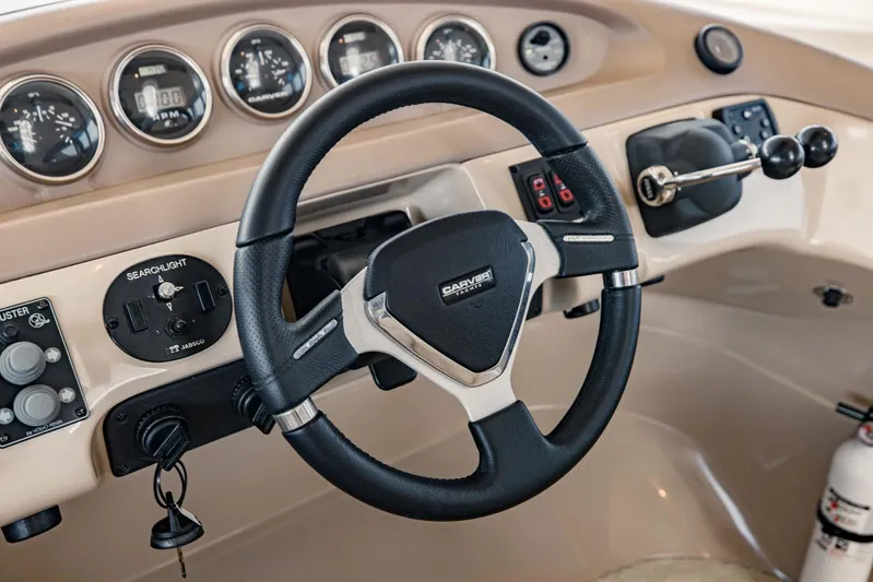 Sonshine Yacht Photos Pics 2004 Carver 56 Voyager helm with steering wheel and control panel.