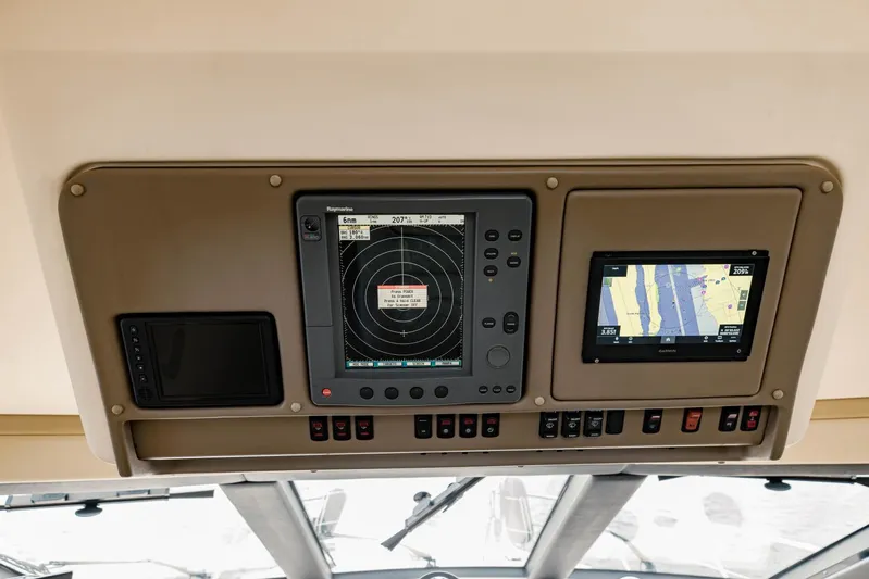 Sonshine Yacht Photos Pics Control panel of a 2004 Carver 56 Voyager with radar and navigation screens.
