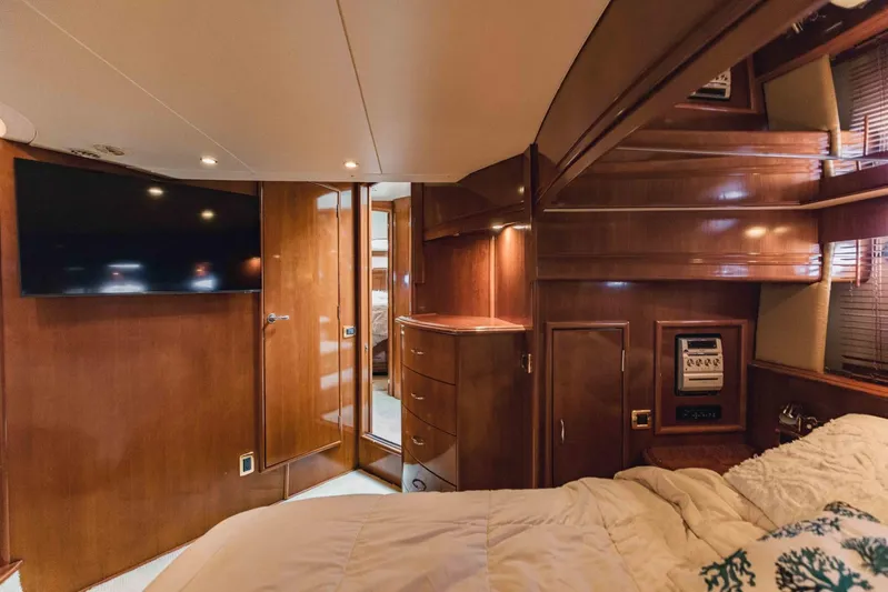 Sonshine Yacht Photos Pics Luxurious interior of a 2004 Carver 56 Voyager yacht with wood paneling and modern amenities.