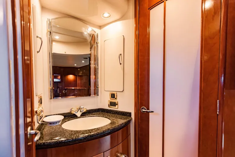 Sonshine Yacht Photos Pics Luxurious bathroom interior of 2004 Carver 56 Voyager yacht with elegant wood finishes.