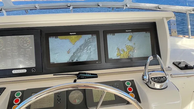 Perseus Yacht Photos Pics Helm of 2004 Fleming 75 yacht with navigation screens and controls.