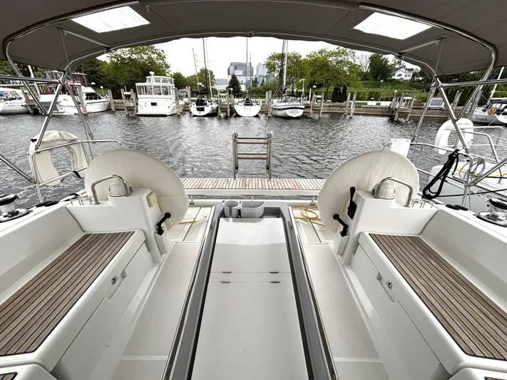 Private Sessions Yacht Photos Pics Beneteau Oceanis 45 yacht cockpit, 2018 model, docked at marina with scenic waterfront view.