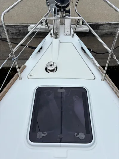 Private Sessions Yacht Photos Pics Bow of 2018 Beneteau Oceanis 45 sailboat with hatch and winch.