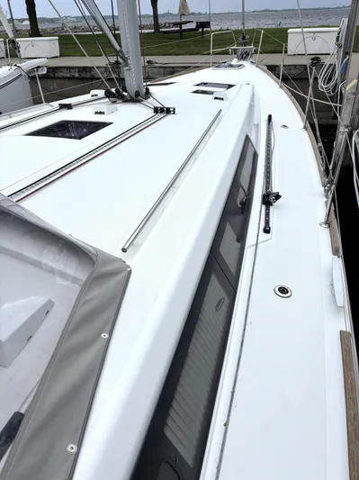 Private Sessions Yacht Photos Pics Beneteau Oceanis 45 sailboat deck, 2018 model, docked with visible hatches and rigging.