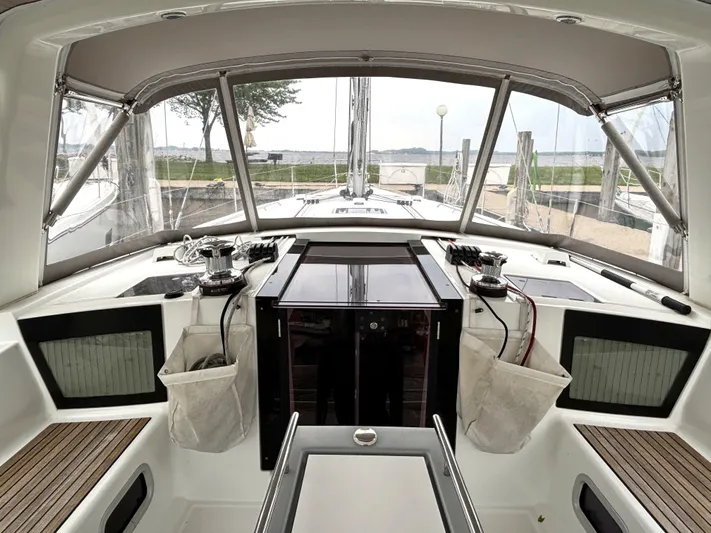 Private Sessions Yacht Photos Pics Cockpit of 2018 Beneteau Oceanis 45 sailboat with clear canopy and winches.