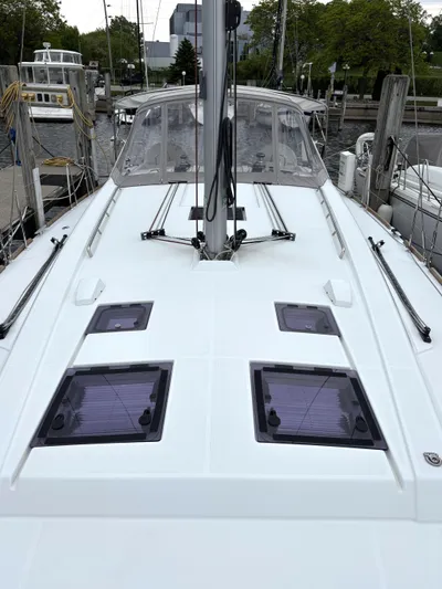 Private Sessions Yacht Photos Pics 2018 Beneteau Oceanis 45 sailboat deck with hatches, docked at marina.