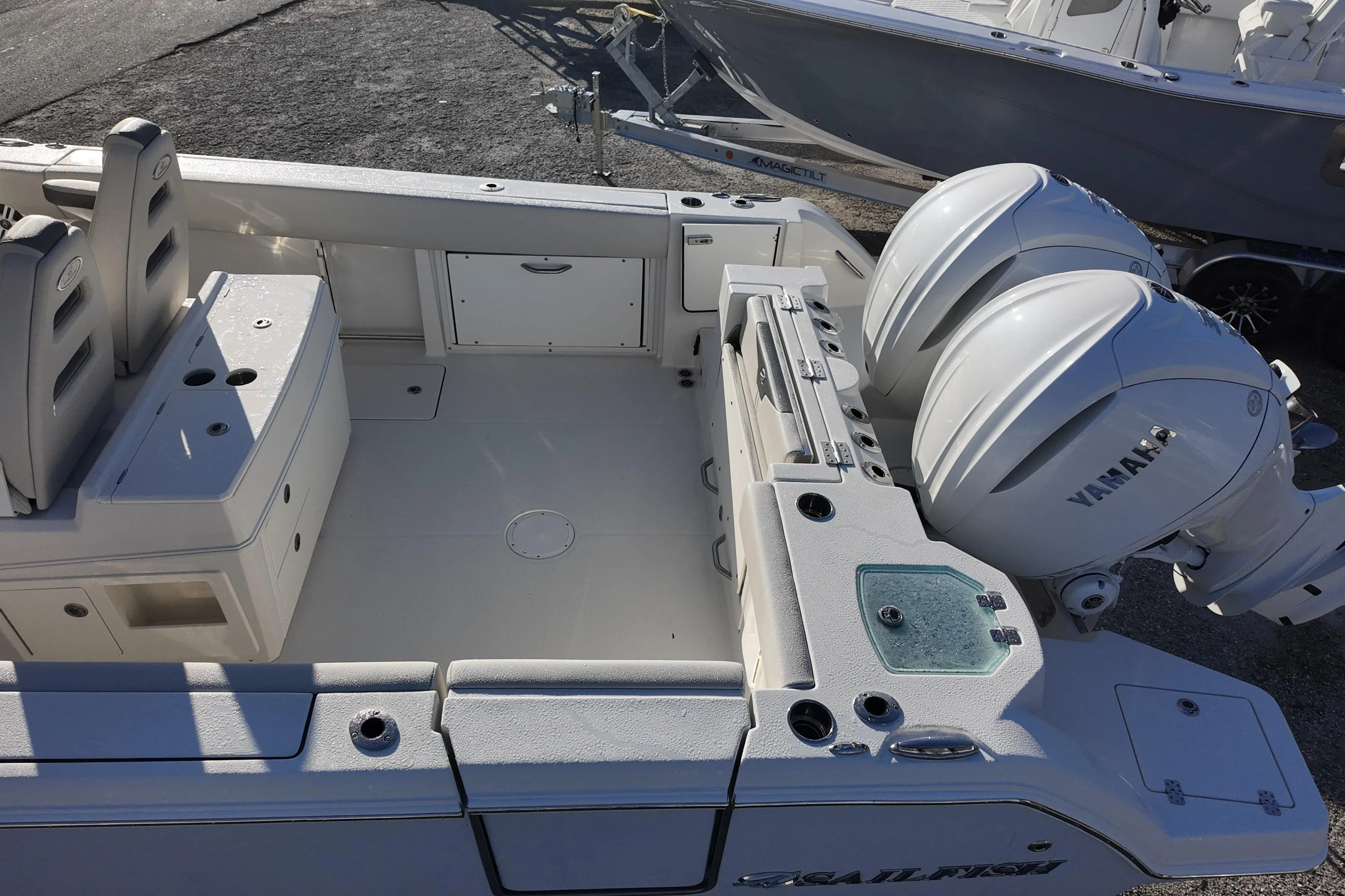 2026 Sailfish 312 CC boat with dual Yamaha engines, spacious deck, and seating area.