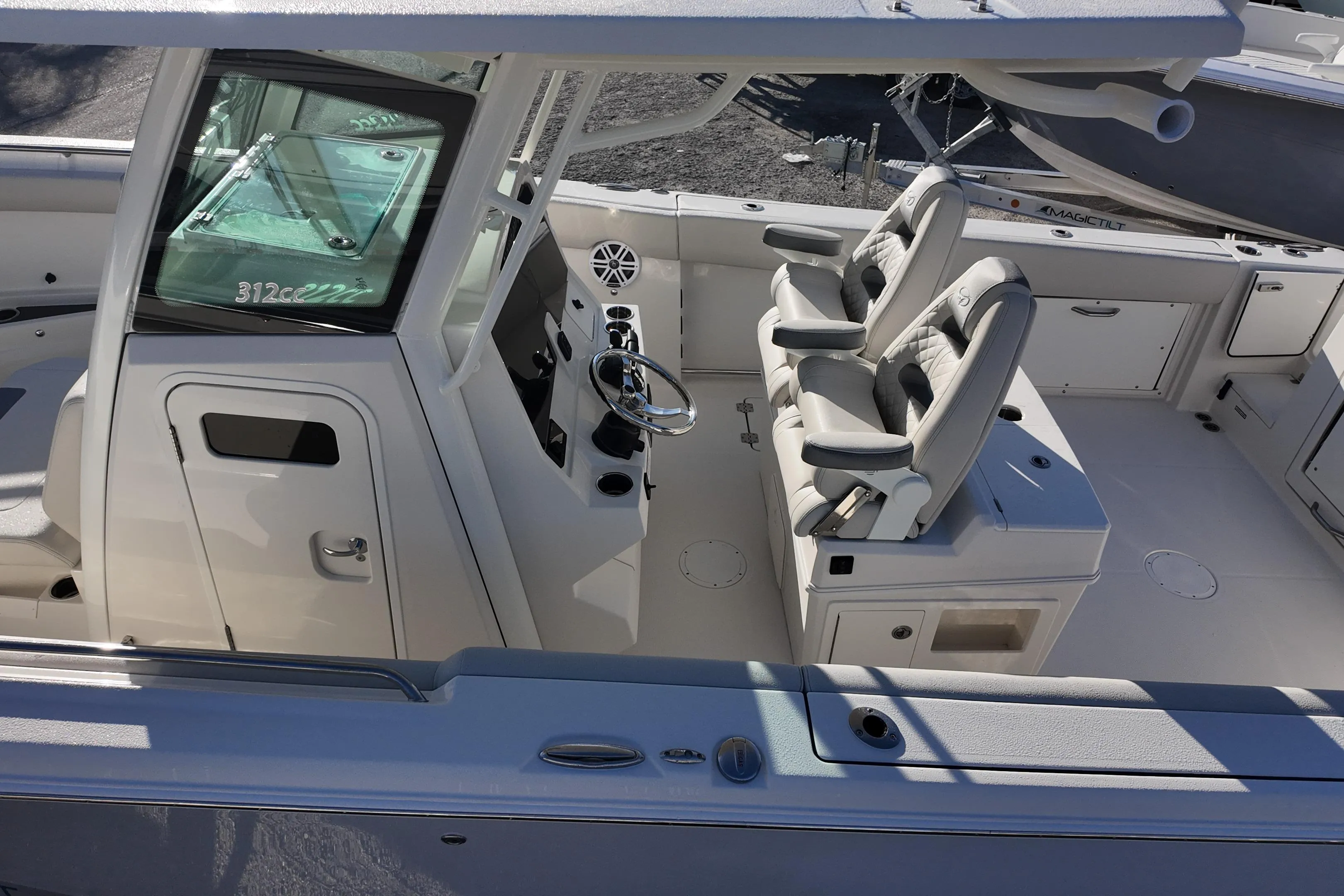 2026 Sailfish 312 CC boat interior with dual captain's chairs and modern helm.