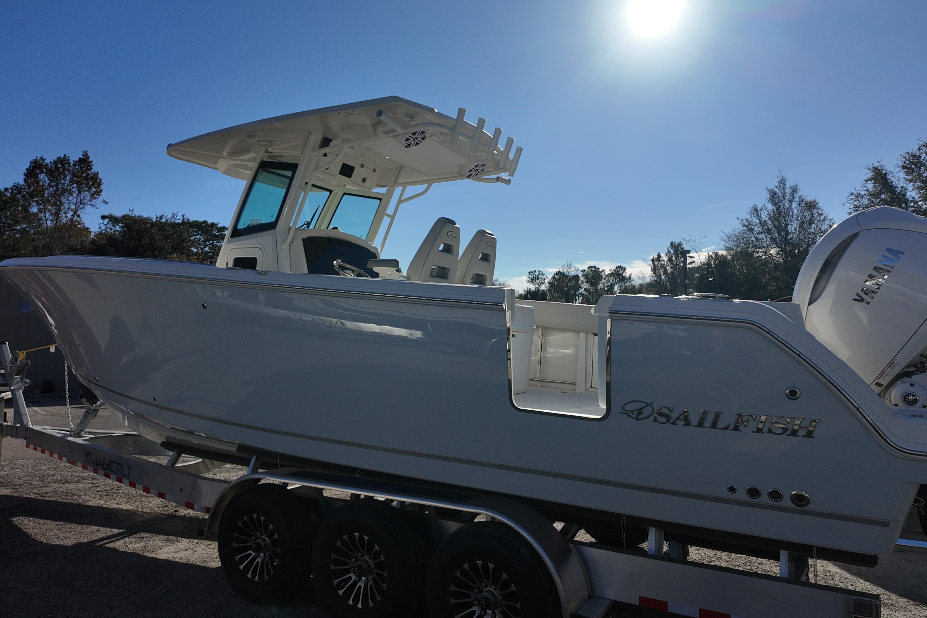2026 Sailfish 312 CC boat on trailer under bright sun.