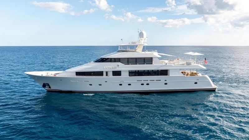 Antares Yacht Photos Pics Westport 130 yacht, 2008 model, cruising on open sea under clear skies.