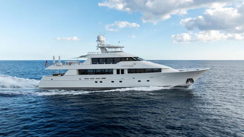 Antares Yacht Photos Pics 2008 Westport 130 yacht cruising on open water under a partly cloudy sky.