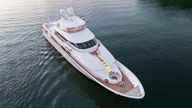 Antares Yacht Photos Pics Aerial view of a 2008 Westport 130 luxury yacht on calm waters.