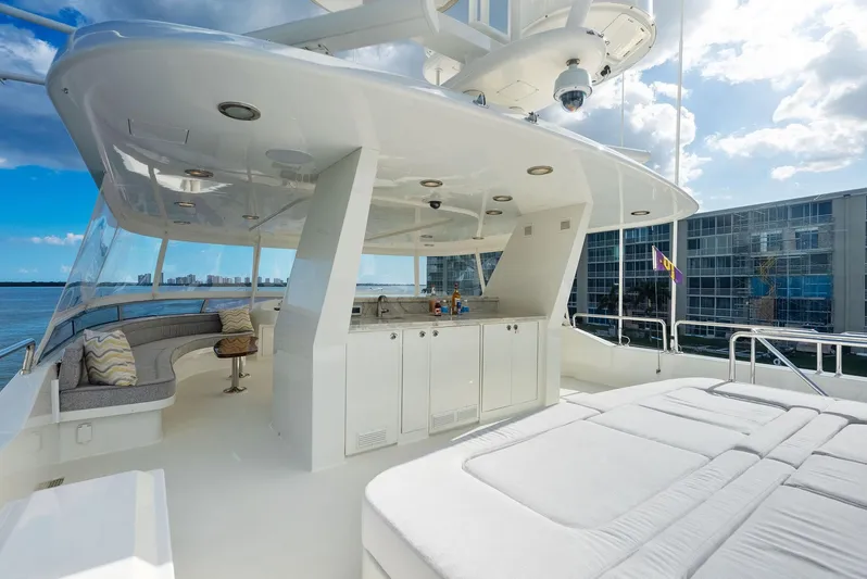 Antares Yacht Photos Pics Luxurious 2008 Westport 130 yacht with spacious outdoor seating and sunbathing area.