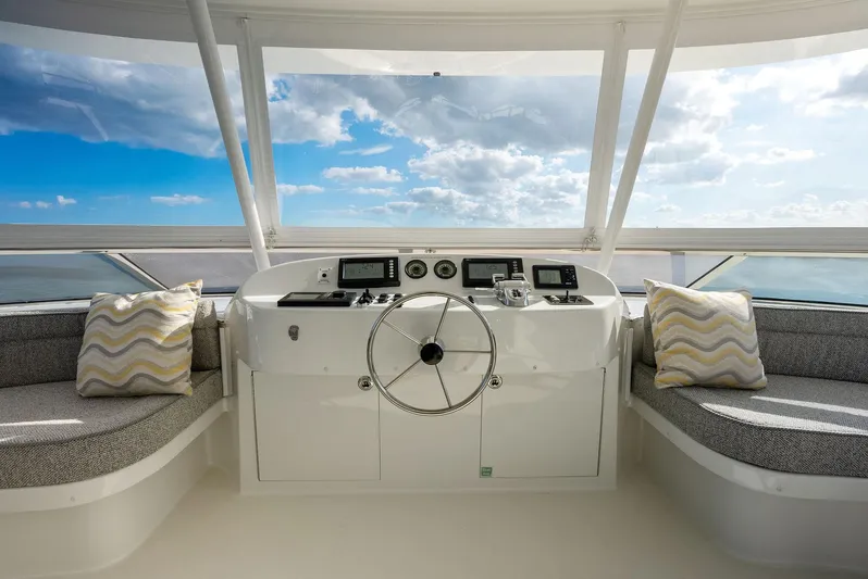 Antares Yacht Photos Pics Helm station of 2008 Westport 130 yacht with panoramic ocean view.