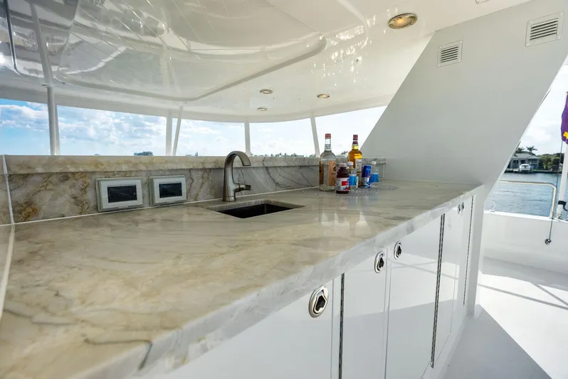 Antares Yacht Photos Pics Luxurious marble countertop with sink on 2008 Westport 130 yacht, featuring scenic ocean view.