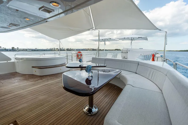 Antares Yacht Photos Pics Luxurious deck of 2008 Westport 130 yacht with elegant seating and ocean view.