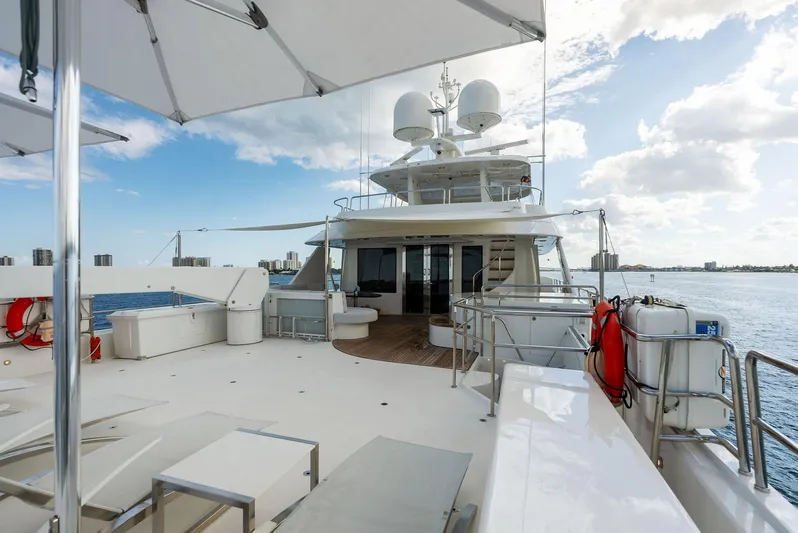Antares Yacht Photos Pics Luxurious deck of 2008 Westport 130 yacht with seating and ocean view.