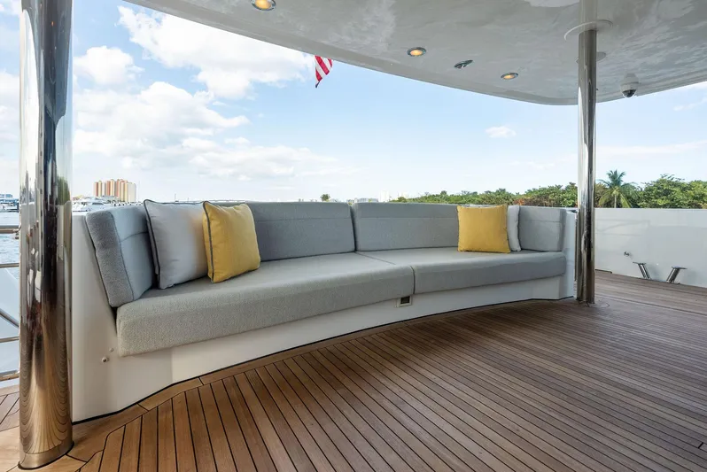 Antares Yacht Photos Pics Luxurious outdoor seating on 2008 Westport 130 yacht with teak deck and scenic view.