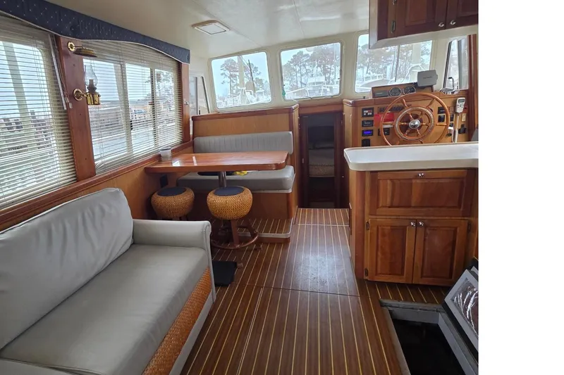 Yacht Photos Pics Interior of 2006 Mainship 40 Trawler with wood accents and comfortable seating.