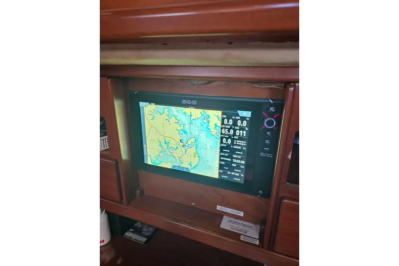 Fiasco Yacht Photos Pics Navigation system on 1988 Amel Sharki yacht, displaying nautical chart and data.