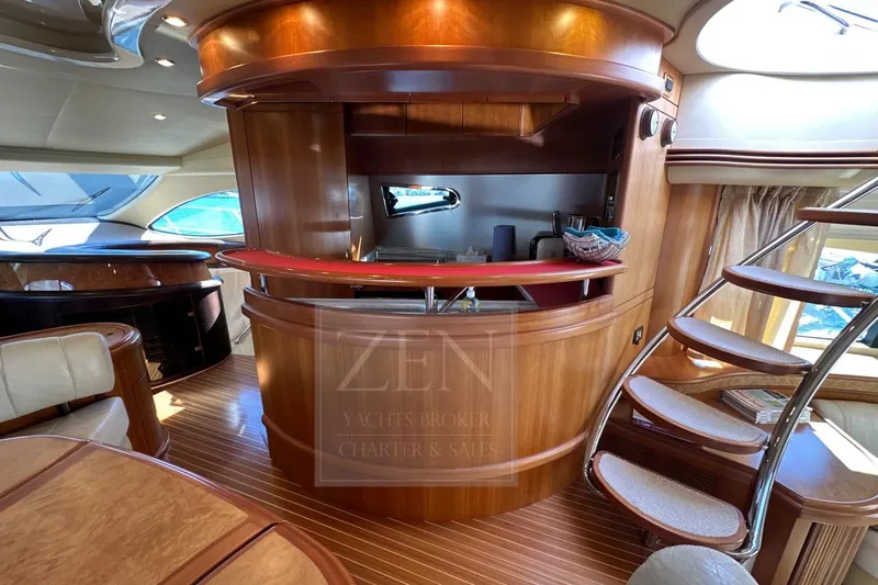  Yacht Photos Pics Luxurious interior of 2009 Azimut 68E yacht with elegant wood finishes and modern design.
