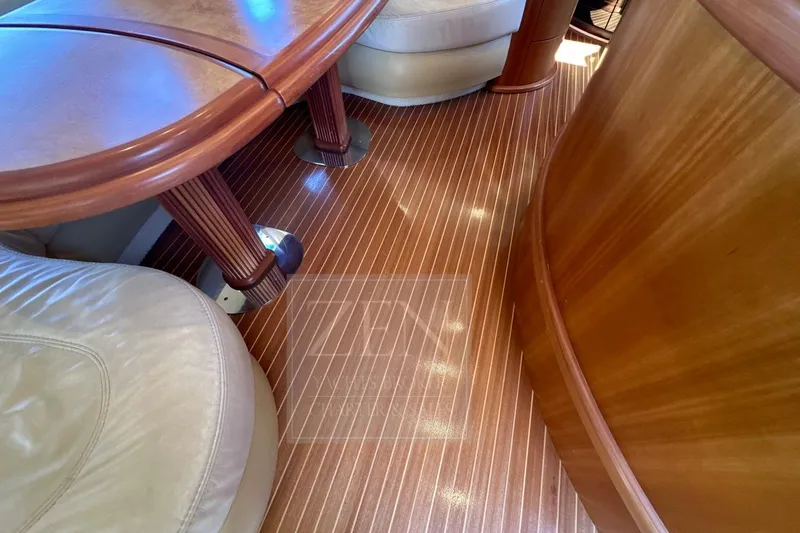  Yacht Photos Pics Luxurious interior of 2009 Azimut 68E yacht with polished wood and leather seating.