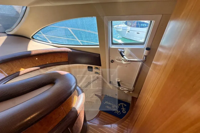  Yacht Photos Pics Interior view of 2009 Azimut 68E yacht, featuring elegant wood and leather finishes.