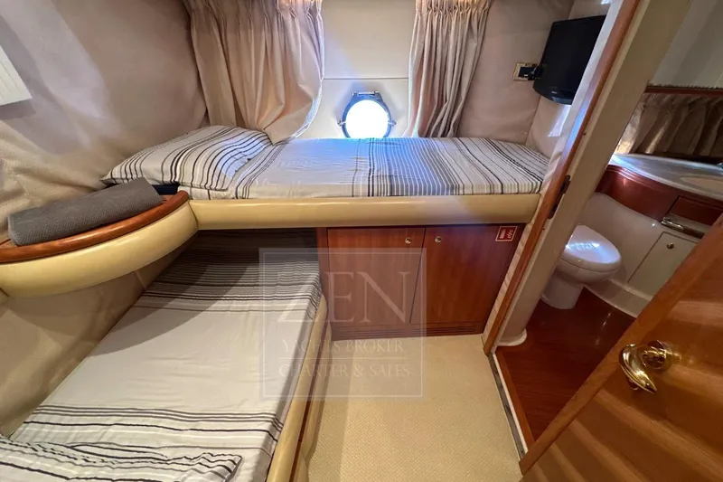  Yacht Photos Pics 2009 Azimut 68E yacht cabin with twin beds and ensuite bathroom.