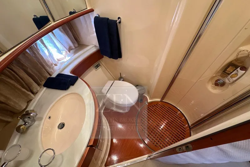  Yacht Photos Pics Luxurious 2009 Azimut 68E yacht bathroom with elegant fixtures and wooden accents.