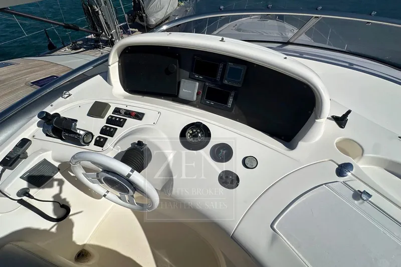  Yacht Photos Pics 2009 Azimut 68E yacht helm with steering wheel, controls, and navigation instruments.