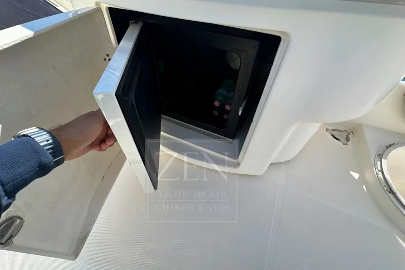  Yacht Photos Pics Hand opening storage compartment on 2009 Azimut 68E yacht deck.