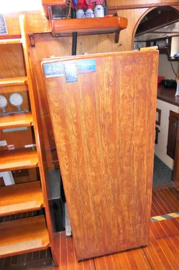 Spirit Yacht Photos Pics 1979 Roberts 54 interior with wooden cabinetry and stairs.