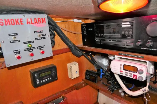 Spirit Yacht Photos Pics Boat control panel with smoke alarm, radio, and navigation equipment in a 1979 Roberts 54.