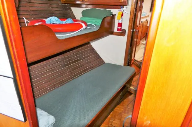 Spirit Yacht Photos Pics 1979 Roberts 54 boat interior with bunk beds and safety equipment.