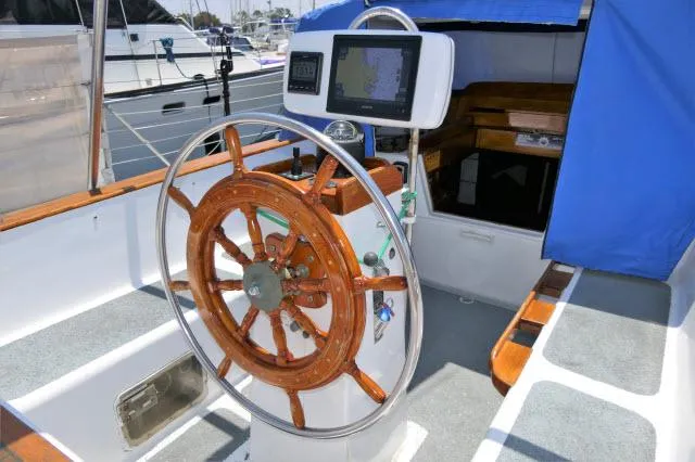 Spirit Yacht Photos Pics Roberts 54 sailboat helm with wooden wheel and navigation system, 1979 model.