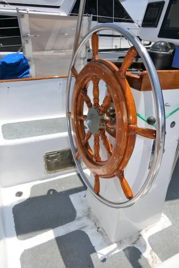 Spirit Yacht Photos Pics Wooden ship wheel on a 1979 Roberts 54 sailboat.
