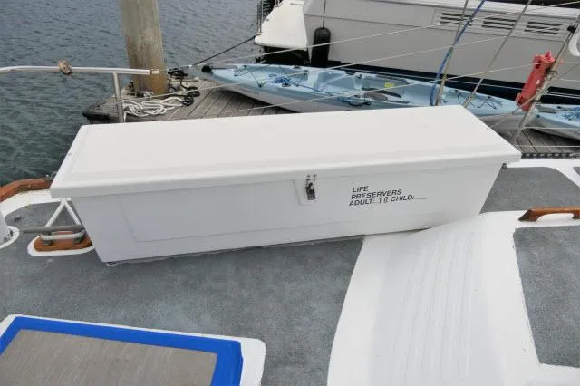 Spirit Yacht Photos Pics White life preserver storage box on a 1979 Roberts 54 boat deck.