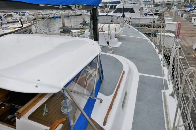 Spirit Yacht Photos Pics 1979 Roberts 54 sailboat docked at marina, view of deck and cockpit.