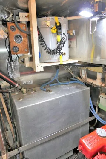 Spirit Yacht Photos Pics Engine room of a 1979 Roberts 54 boat with fuel tank and electrical panel.