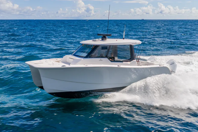  Yacht Photos Pics 2026 Hammer Yachts 35HH catamaran cruising on open sea under clear skies.