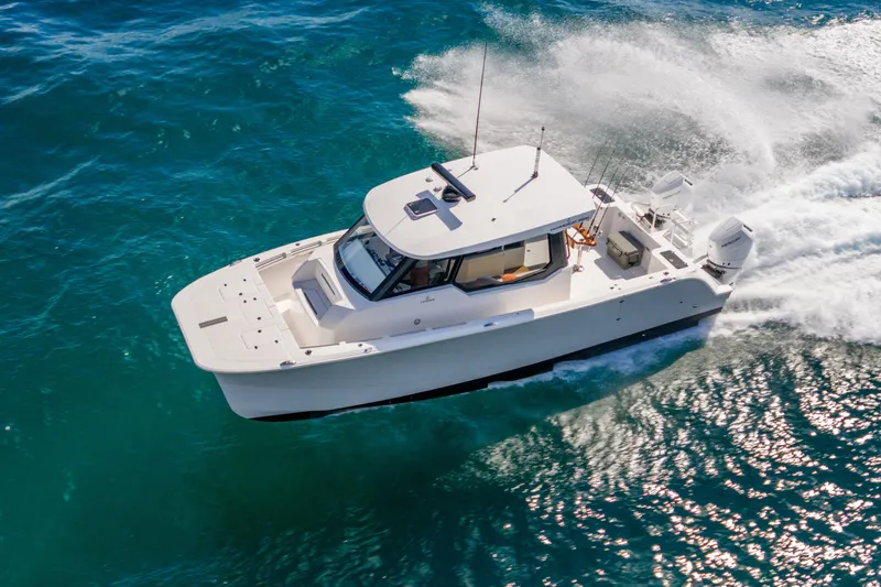  Yacht Photos Pics 2026 Hammer Yachts 35HH cruising on vibrant blue ocean waters.