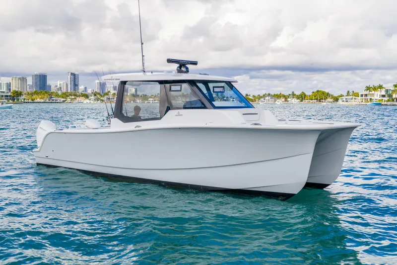  Yacht Photos Pics 2026 Hammer Yachts 35HH catamaran on water, city skyline in background.