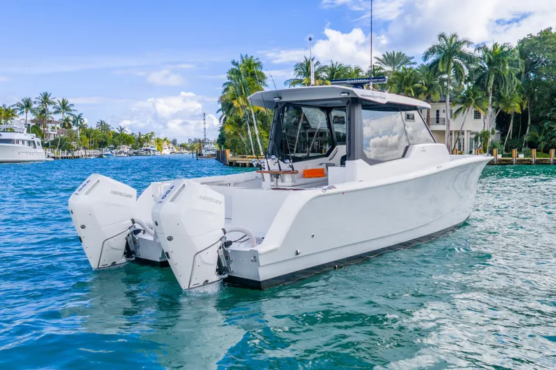  Yacht Photos Pics 2026 Hammer Yachts 35HH boat on tropical water with twin Mercury engines.