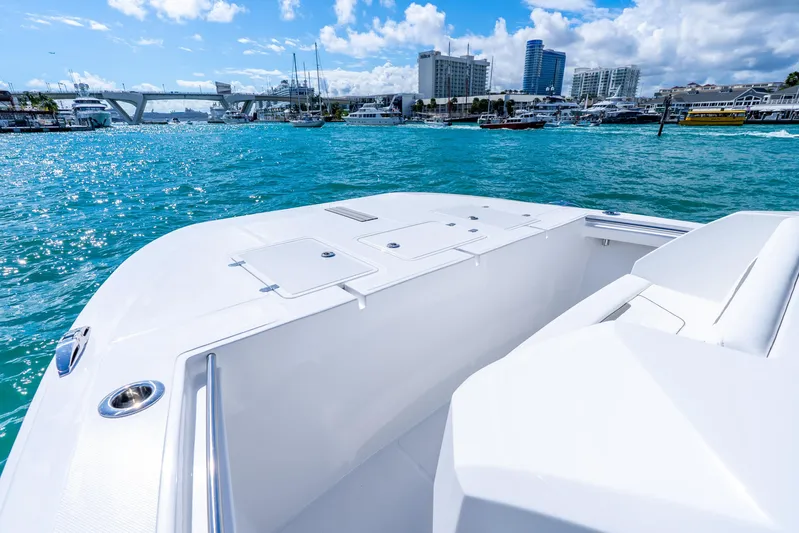  Yacht Photos Pics 2026 Hammer Yachts 35HH on vibrant blue water with city skyline backdrop.