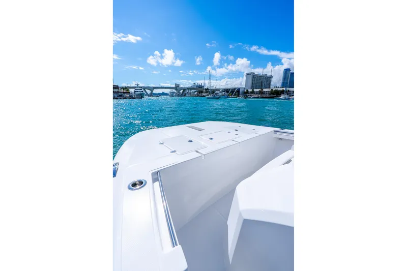 Yacht Photos Pics 2026 Hammer Yachts 35HH on clear blue water, city skyline in background.