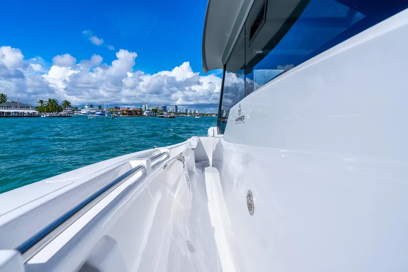  Yacht Photos Pics 2026 Hammer Yachts 35HH cruising on clear blue waters under a vibrant sky.