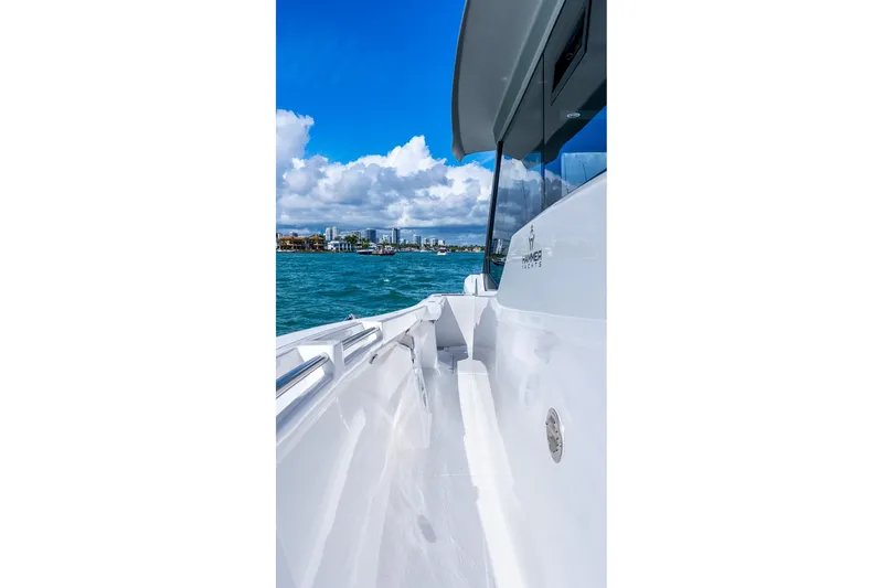  Yacht Photos Pics Sleek Hammer Yachts 35HH cruising on blue waters, 2026 model.